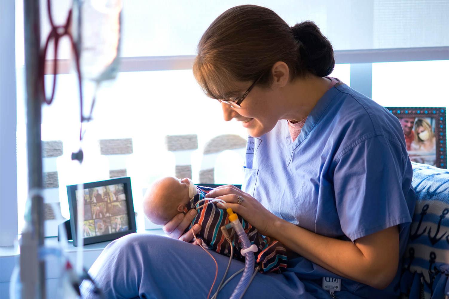 woman holding newborn baby