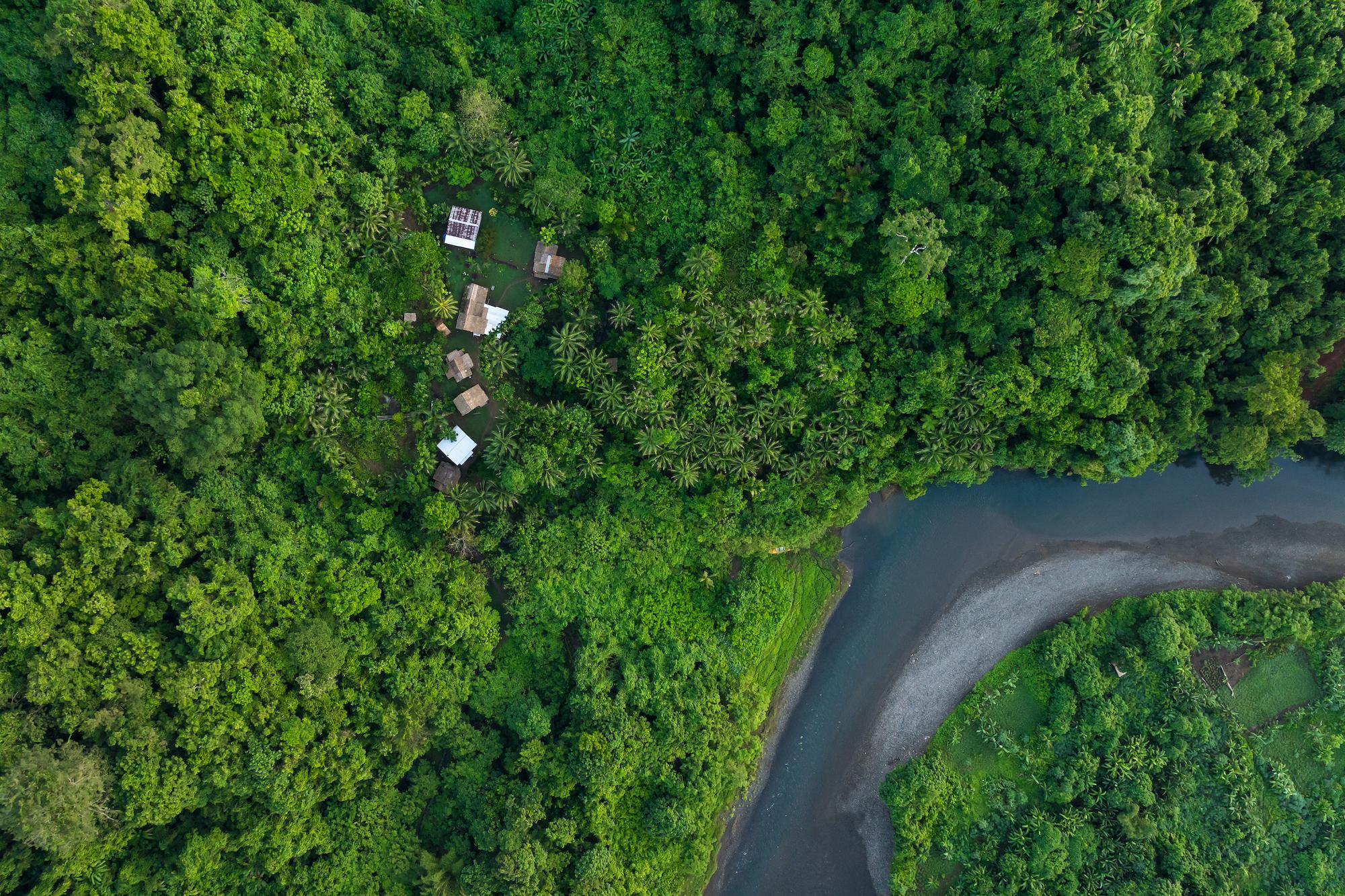 Aerial drone view of Hariga River and Hariga Village, Makira Island, Solomon Islands